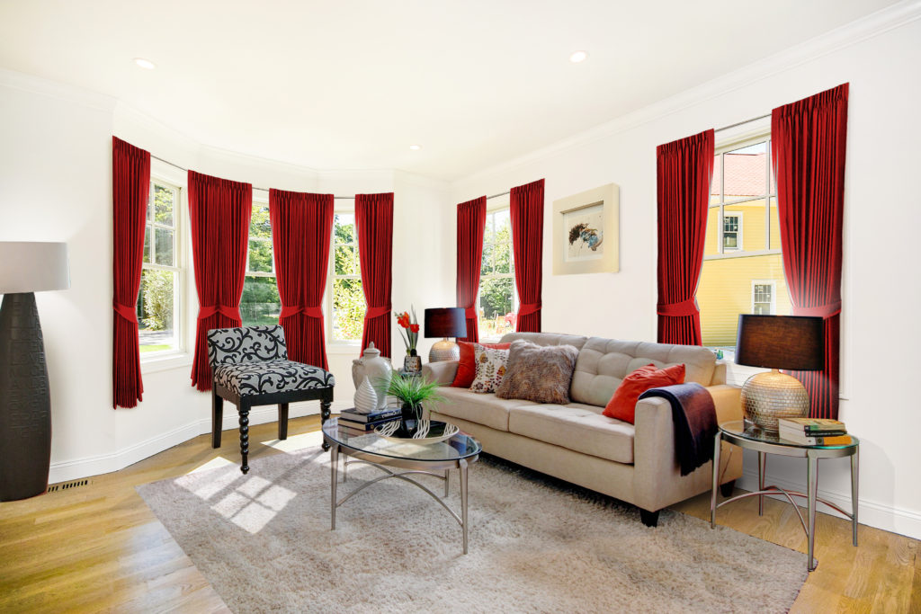 Embrace symmetry when staging your living room. Coordinated sets, like these pillows, are pleasing to a buyer's eye.